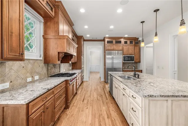 a bathroom with a toilet sink vanity and mirror