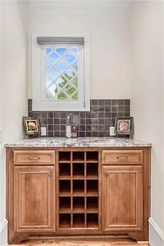 a white bath tub sitting in a bathroom next to a window