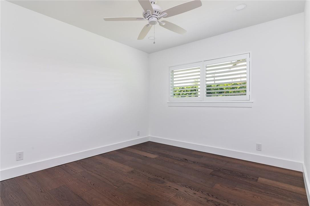 831 Hickory Terrace Boca Raton, FL 33486 - Photo 13 of 25 wooden floor in an empty room with a window