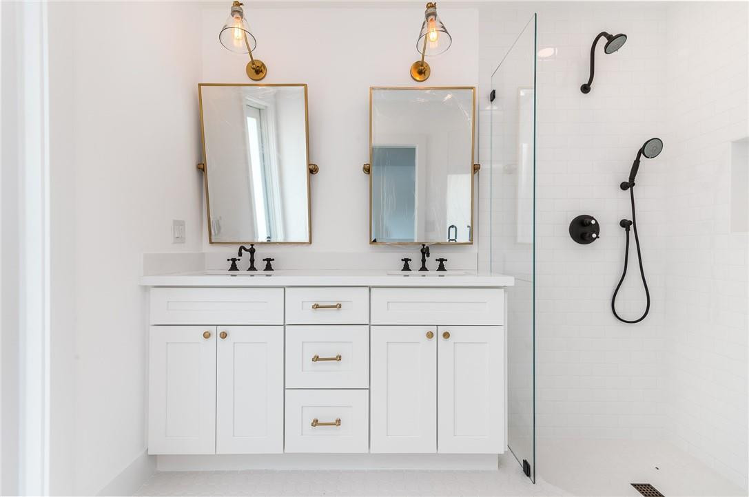 831 Hickory Terrace Boca Raton, FL 33486 - Photo 4 of 25 a bathroom with a double vanity sink mirror and