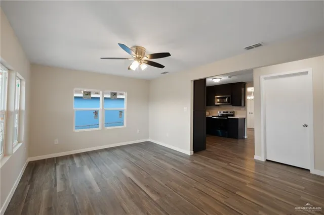 a view of kitchen with a sink and a stove top oven