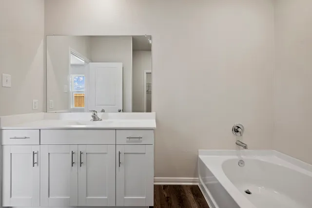 a bathroom with a sink and a bathtub