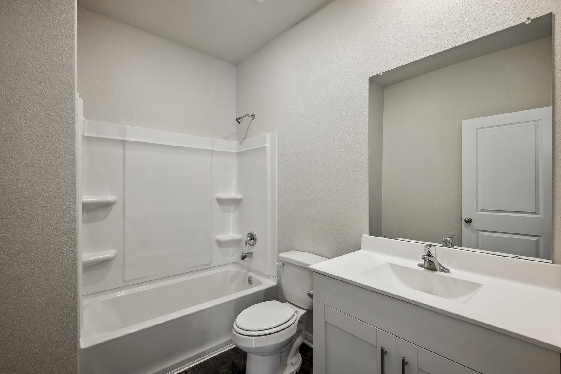 10347 Red Cardinal Drive Cleveland, TX 77328 - Photo 17 of 22 a bathroom with a sink toilet and shower