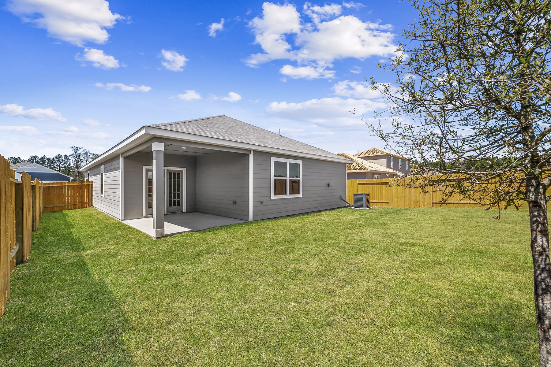 10347 Red Cardinal Drive Cleveland, TX 77328 - Photo 2 of 22 a house view with a garden space
