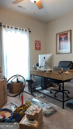 a living room with furniture and a mirror