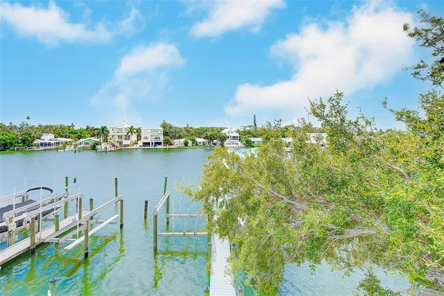 a view of a wooden deck with a yard