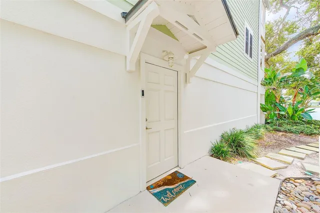 a swimming pool with lawn chairs and pool view