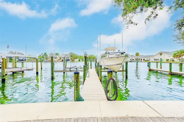 an aerial view of a houses with a lake view