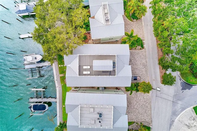 an aerial view of multiple house with outdoor space