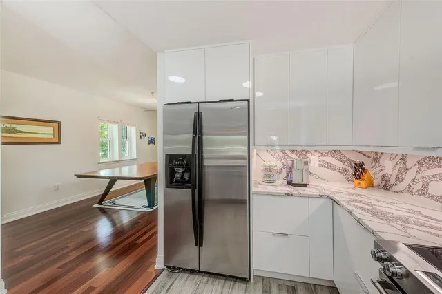 a kitchen with a sink stove and refrigerator