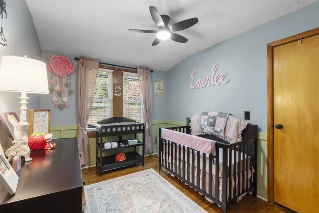 a bedroom with furniture and a window