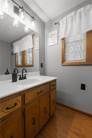 a bathroom with a sink and a mirror