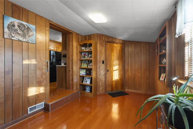 a view of entryway with wooden floor
