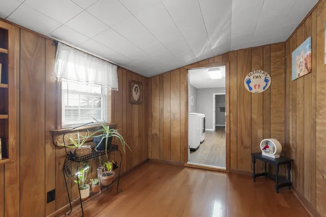 a view of an entryway with wooden floor