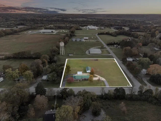 an aerial view of a residential houses with outdoor space