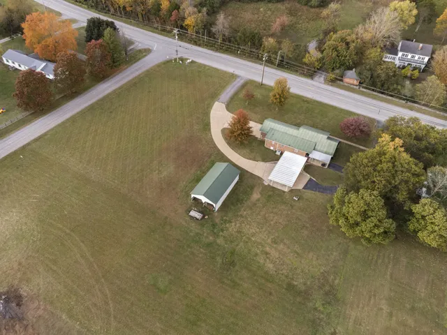 a view of a swimming pool with a yard