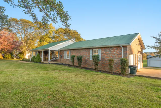a view of a house with a garden