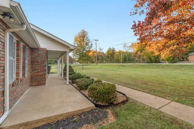 a view of a backyard with an outdoor space