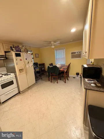 a view of a kitchen with furniture and a kitchen