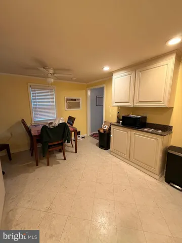 a kitchen with sink and cabinets