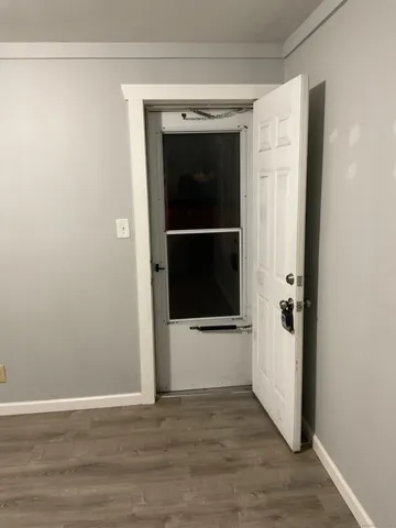 a view of entryway with wooden floor