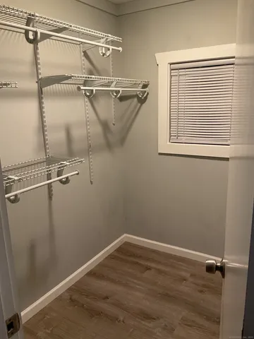 a view of a room with rack on the wall and shower