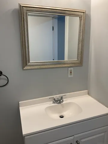 a bathroom with a sink and vanity
