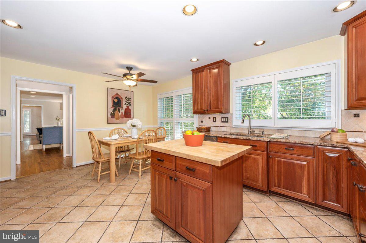 10 Megans Court Olney, MD 20832 - Photo 16 of 47 a kitchen with a sink stove and cabinets