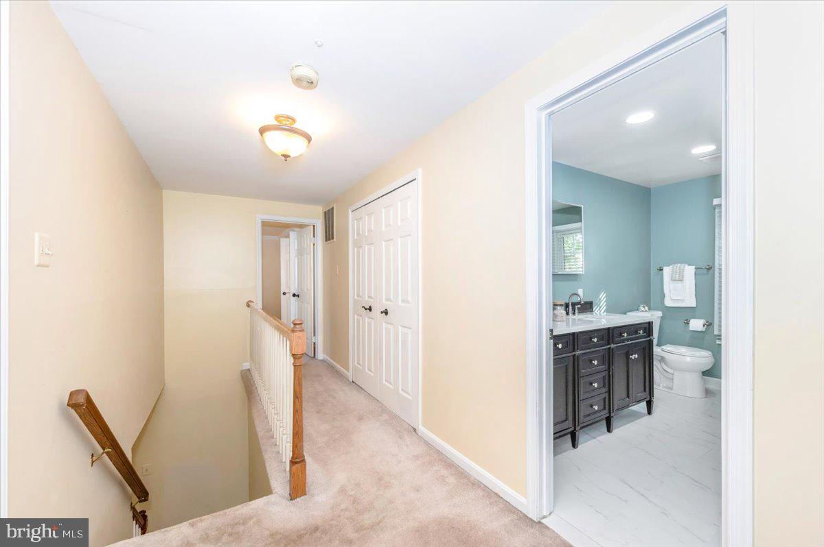 10 Megans Court Olney, MD 20832 - Photo 19 of 47 a view of a hallway to a livingroom with furniture
