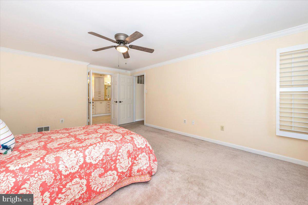 10 Megans Court Olney, MD 20832 - Photo 21 of 47 a bedroom with a bed and a window