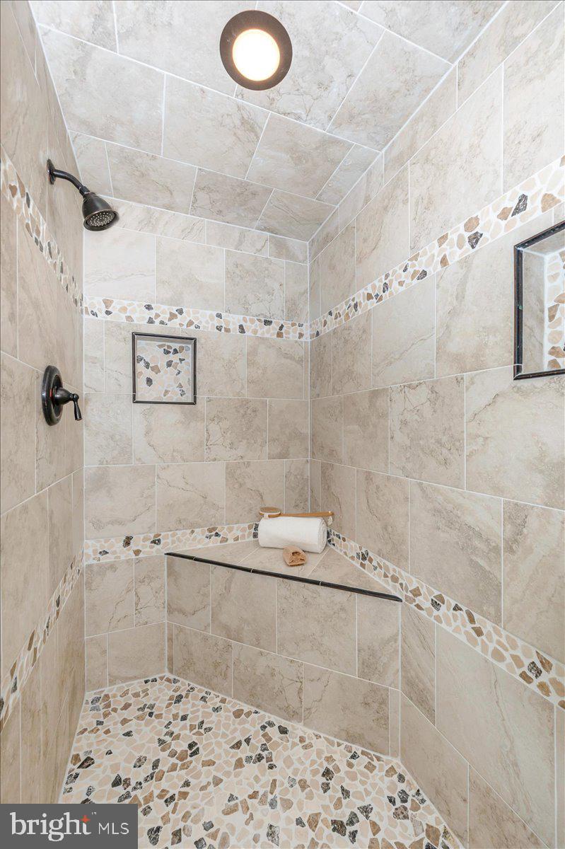 10 Megans Court Olney, MD 20832 - Photo 24 of 47 a bathroom with a shower