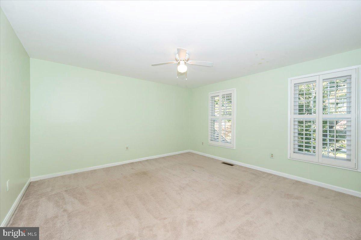10 Megans Court Olney, MD 20832 - Photo 29 of 47 an empty room with windows and closet