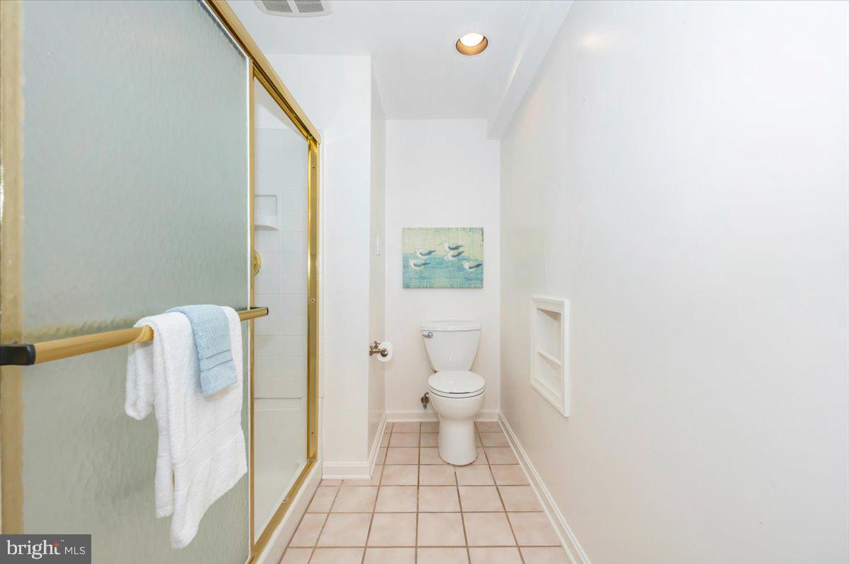 10 Megans Court Olney, MD 20832 - Photo 37 of 47 a bathroom with a toilet and a shower