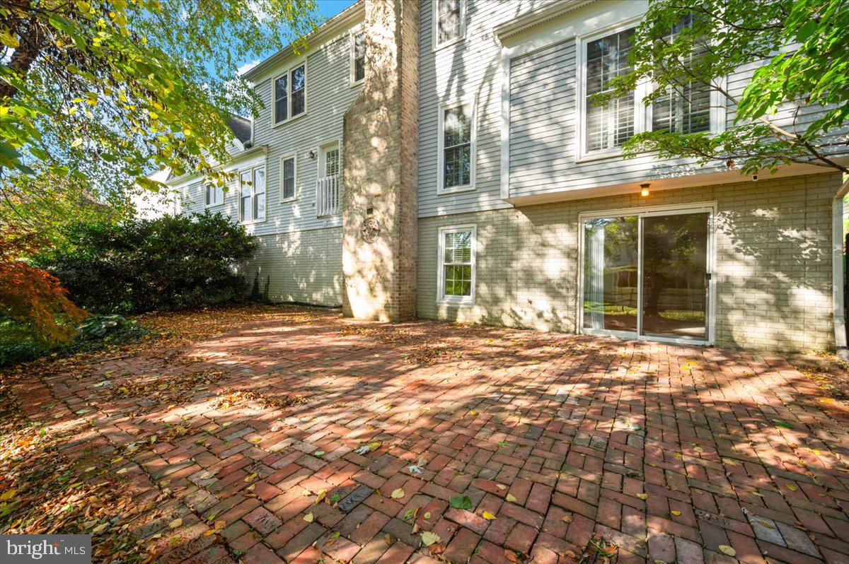 10 Megans Court Olney, MD 20832 - Photo 40 of 47 a view of a brick house with a large windows and plants