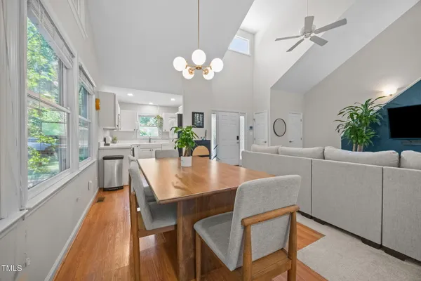 a view of a dining room with furniture window and wooden floor