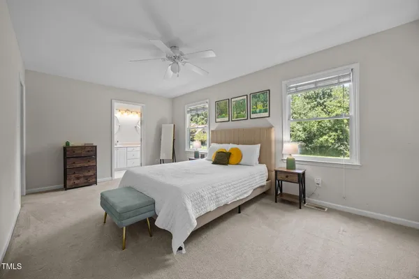 a bedroom with a bed chair and window