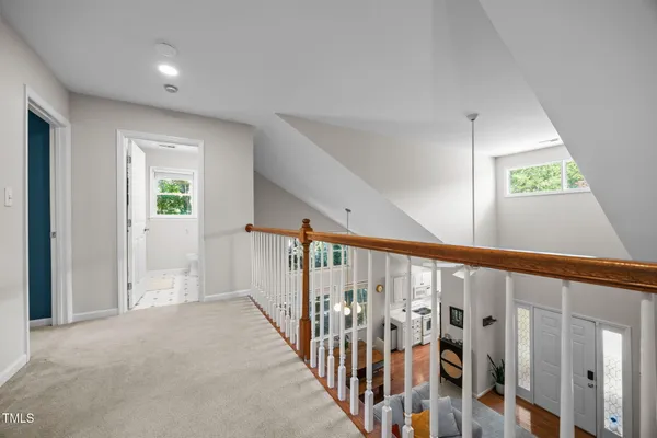 a view of an entryway with wooden floor