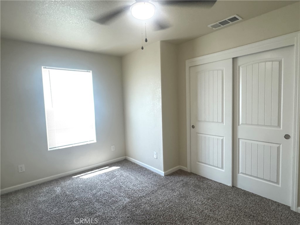 1339 Playa Del Rey Drive Merced, CA 95348 - Photo 35 of 48 an empty room with windows