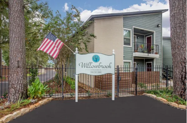 a view of a house with a fence