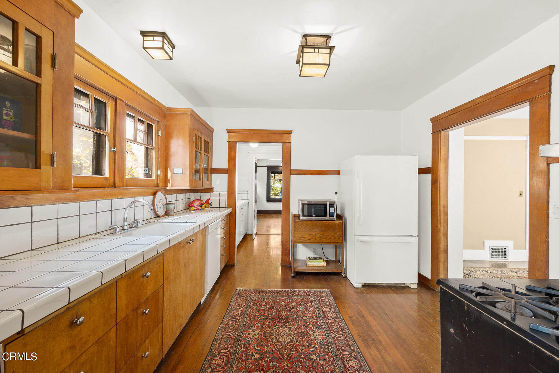 310 Congress Place Pasadena, CA 91105 - Photo 9 of 23 a large kitchen with stainless steel appliances granite countertop a refrigerator and a stove