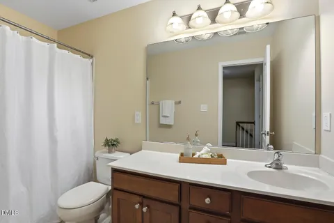 a view of an empty room and closet area