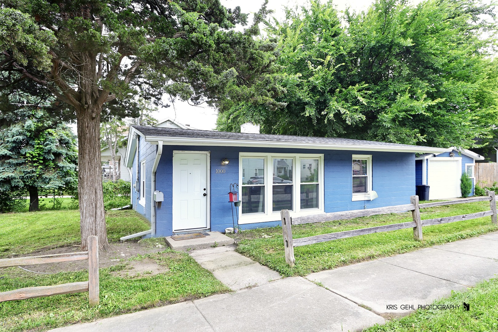a view of a house with a yard in front of a house