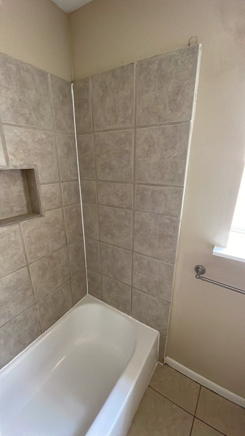 1305 Adams Street, Unit 4 Conroe, TX 77301 - Photo 12 of 32 a bathroom with a bathtub