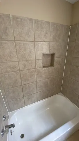 a bathroom with a sink and a shower