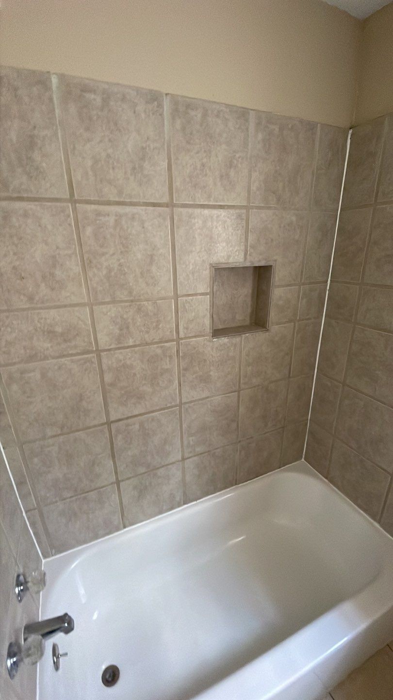 1305 Adams Street, Unit 4 Conroe, TX 77301 - Photo 13 of 32 a bathroom with a bathtub