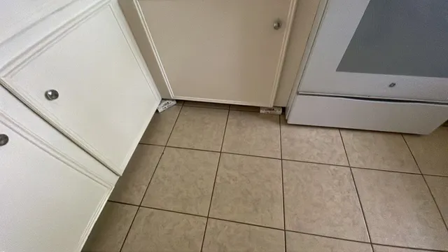 a view of a livingroom with a ceiling fan and window