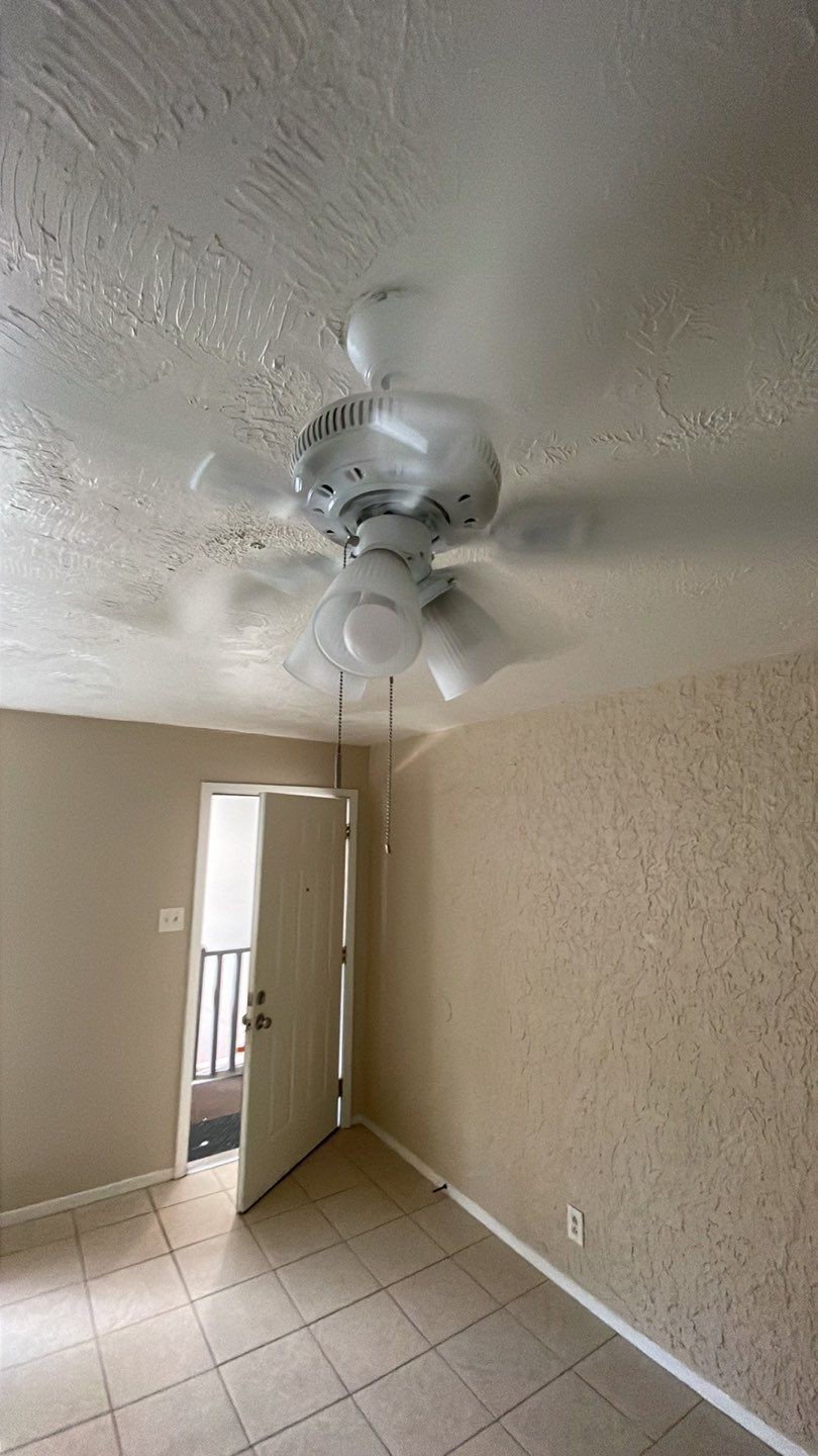 1305 Adams Street, Unit 4 Conroe, TX 77301 - Photo 28 of 32 a view of a livingroom with a ceiling fan and window