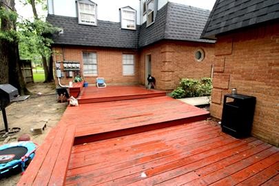 1305 Adams Street, Unit 4 Conroe, TX 77301 - Photo 32 of 32 a backyard of a house with seating space