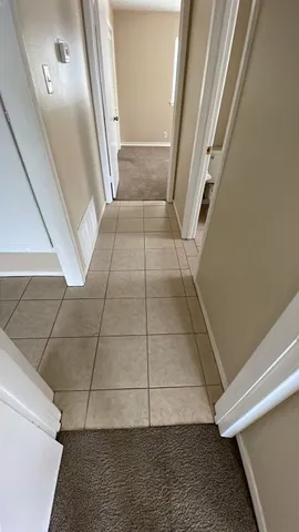 wooden floor in a hall with a window