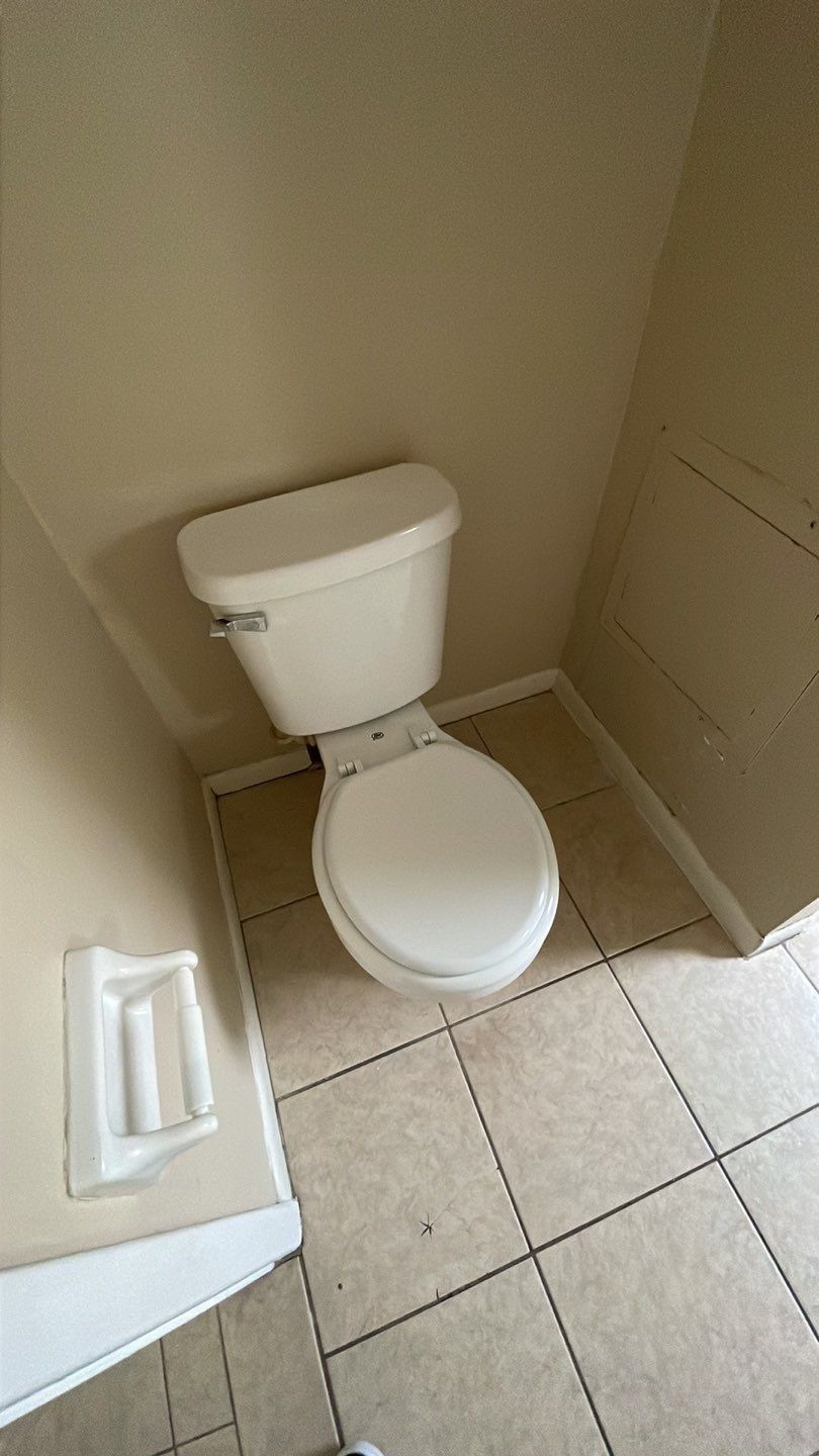 1305 Adams Street, Unit 4 Conroe, TX 77301 - Photo 9 of 32 a bathroom with a toilet and a sink